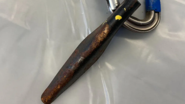 An image provided by Okanogan County Sheriff’s Office shows the rusted piton that failed, resulting in the deaths of three climbers