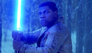 Finn holding lightsaber the force awakens