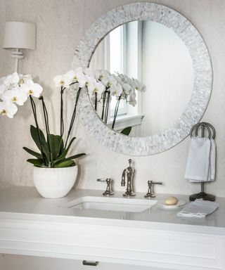 Bathroom countertop decorated with a decorative towel holder