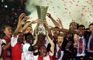 Feyenoord players celebrate after winning the UEFA Cup final against Borussia Dortmund in May 2002.