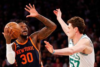Julius Randle #30 of the New York Knicks goes to the basket as Mike Muscala #57 of the Boston Celtics defends during the second half at Madison Square Garden on February 27, 2023 in New York City. 