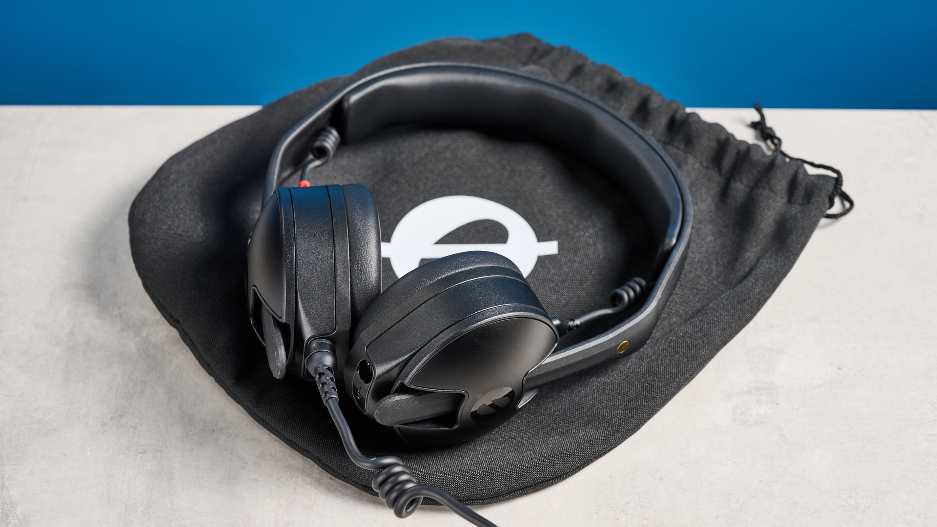 the rode nth-50 studio headphones in black showing the long cable, 3.5mm jack, 1/4 jack, and in use