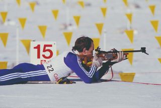 Trevor King takes a shot during a biathlon