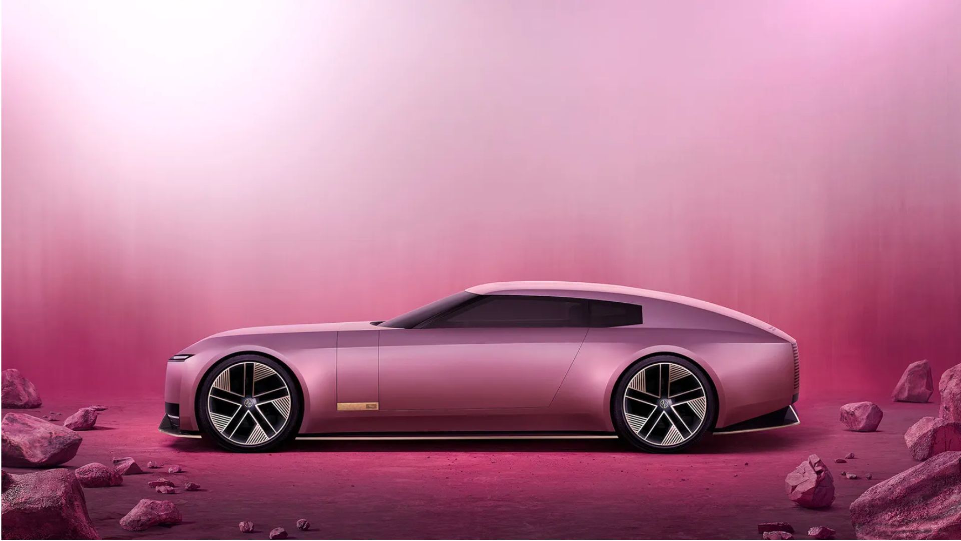 an image of the pink Jaguar type 00 car against a gradient pink backdrop. The car is on a pink sandy textured floor with some pink crumbling rocks on the corners