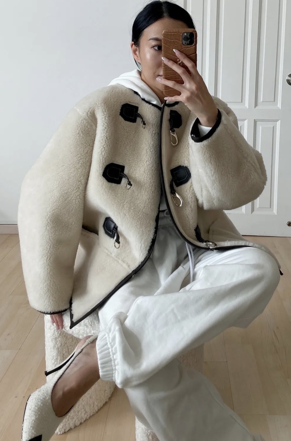 Fashion person Savina Chow @savinachow wears the H&amp;amp;M faux shearling jacket.