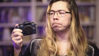 Panasonic Lumix G1 being held by photographer James Artaius, pulling a quizzical face