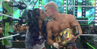 Brandi Rhodes kissing Cody in the ring