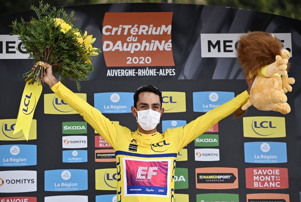 Team Education First rider Colombias Daniel Martinez celebrates his overall leaders yellow jersey on the podium at the end of the fifth stage of the 72nd edition of the Criterium du Dauphine cycling race 153 km between Megeve and Megeve on August 16 2020 Photo by AnneChristine POUJOULAT POOL AFP Photo by ANNECHRISTINE POUJOULATPOOLAFP via Getty Images