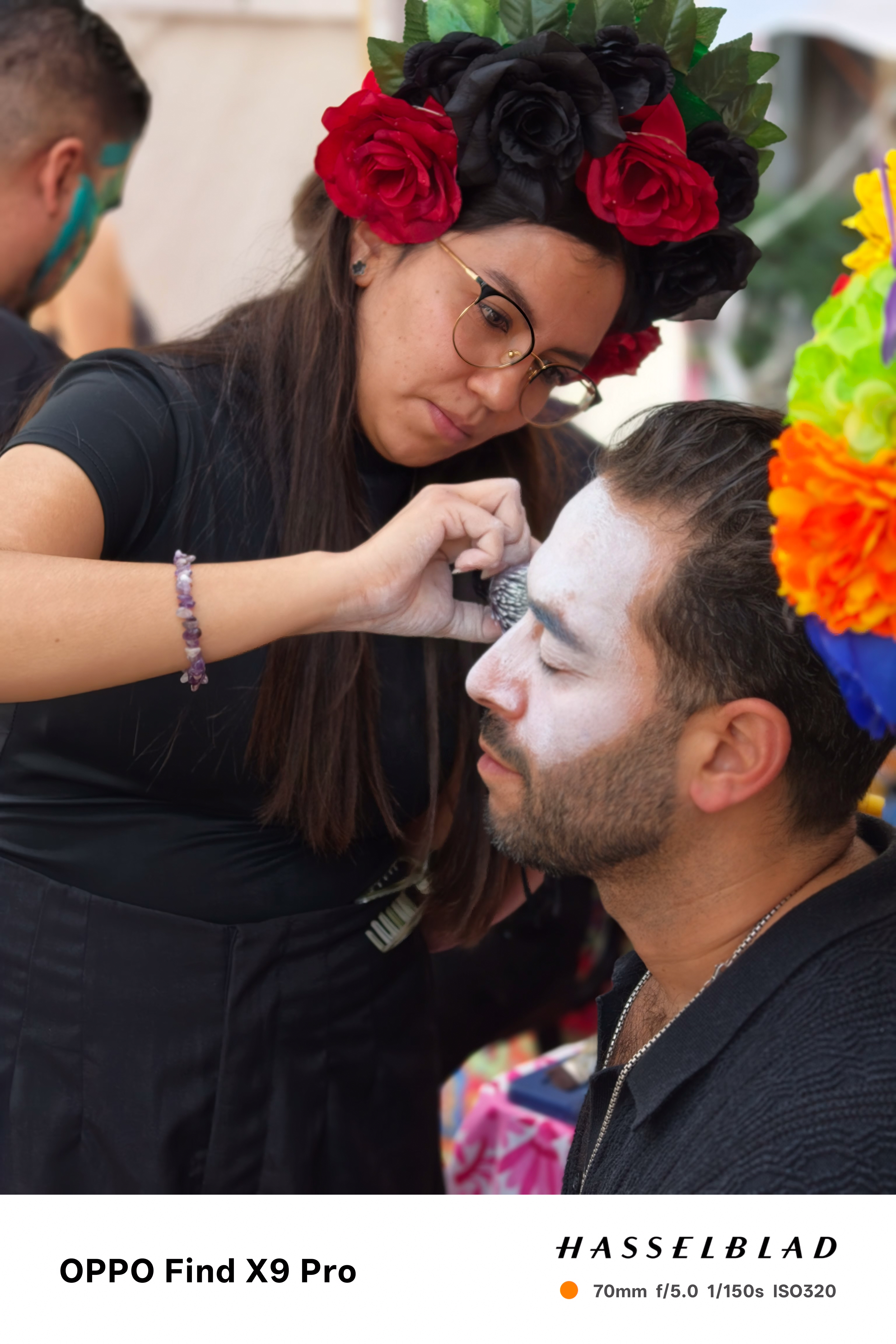 A person having day of the dead make up applied in Mexico