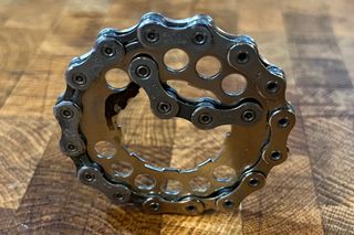 A bottle opener made from a bicycle chain