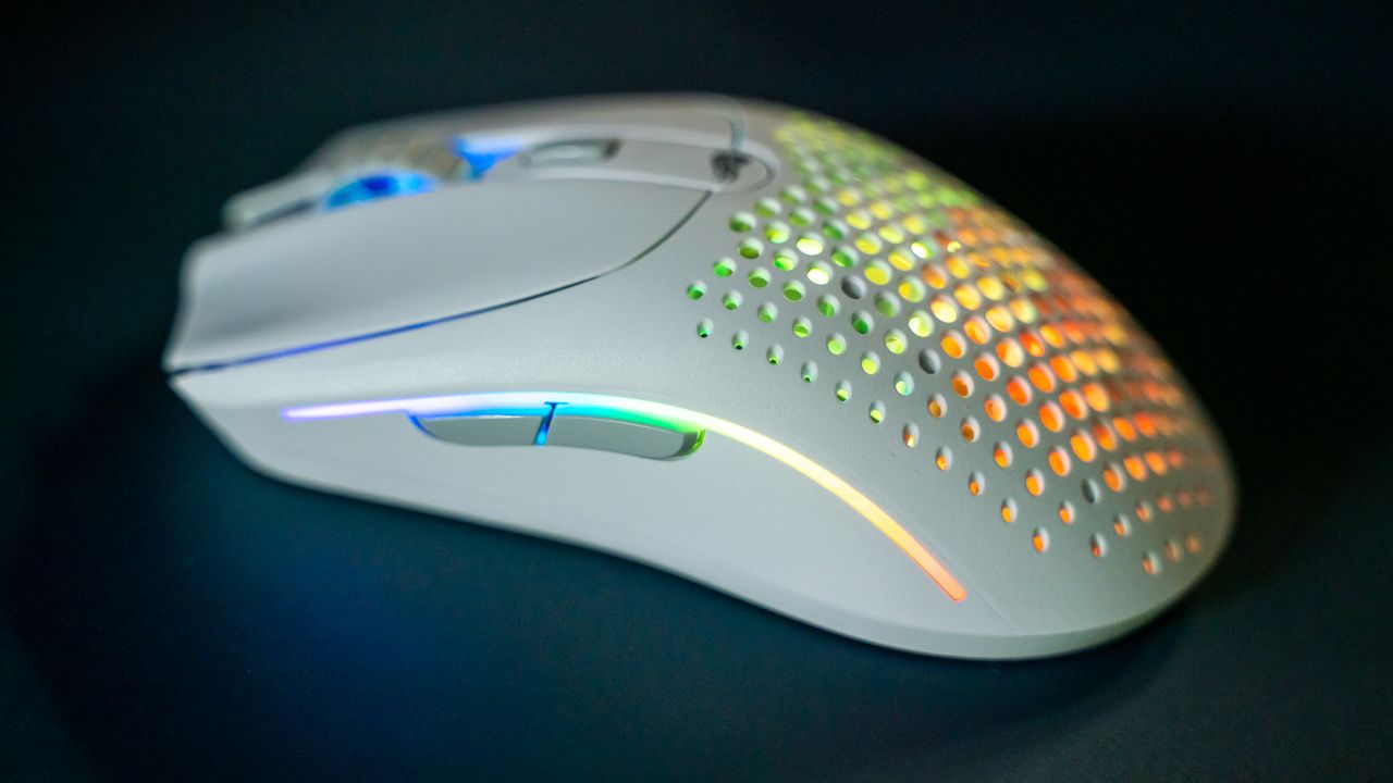 Glorious O2 Wireless on a dark blue desk pad