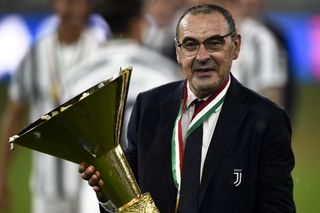 Juventus coach Maurizio Sarri celebrates with the Serie A trophy in August 2020.