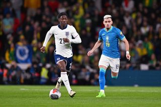Kobbie Mainoo of England battles for possession with Andreas Pereira of Brazil during the international friendly match between England and Brazil at Wembley Stadium on March 23, 2024 in London, England. (Photo by Michael Regan - The FA/The FA via Getty Images) Euro 2024
