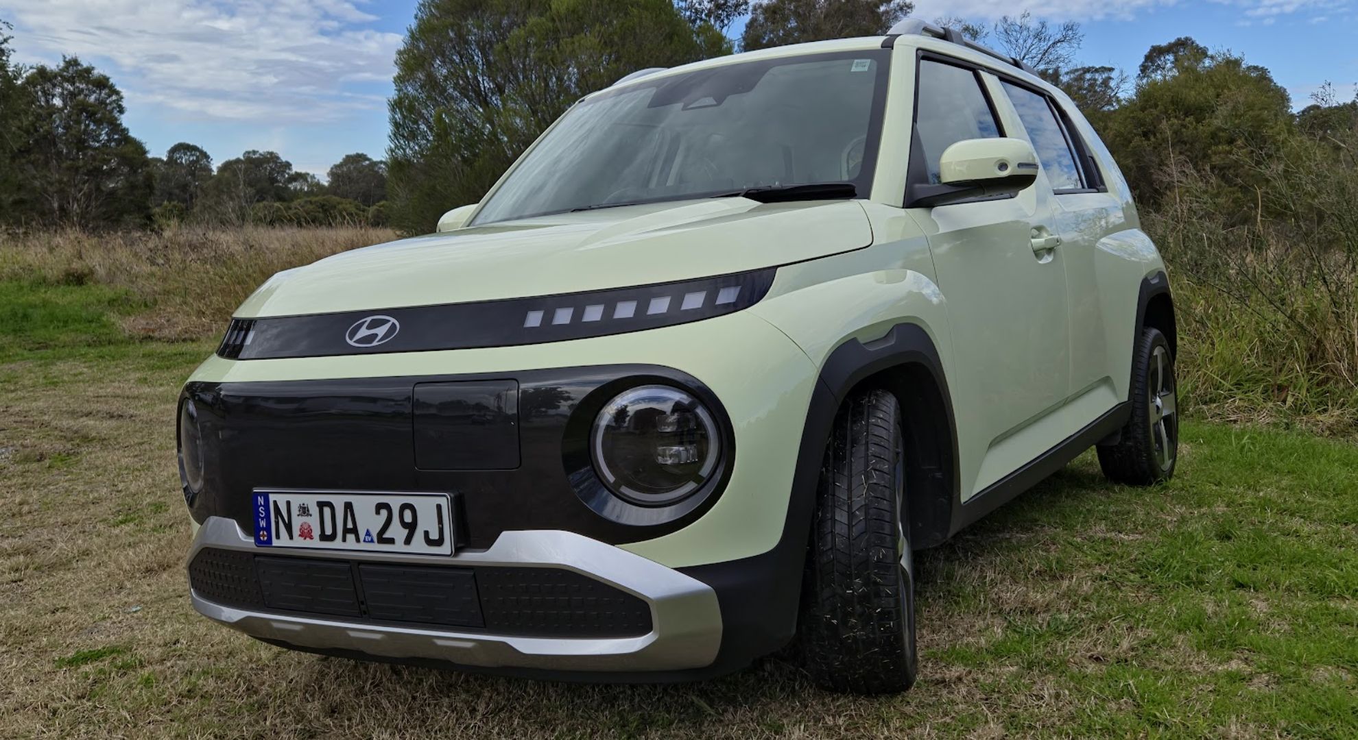 The Hyundai Inster parked on grass