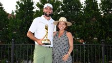 Scottie Scheffler and his wife Meredith with the Players Championship trophy