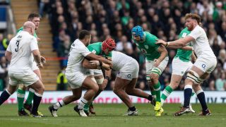 Ellis Genge of England tackles Josh van der Flier of Ireland (centre) during the Guinness Six Nations 2024 match between England and Ireland at Twickenham Stadium on March 9, 2024 in London, England