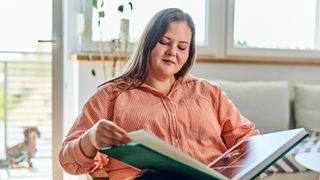 Woman looking at photo album