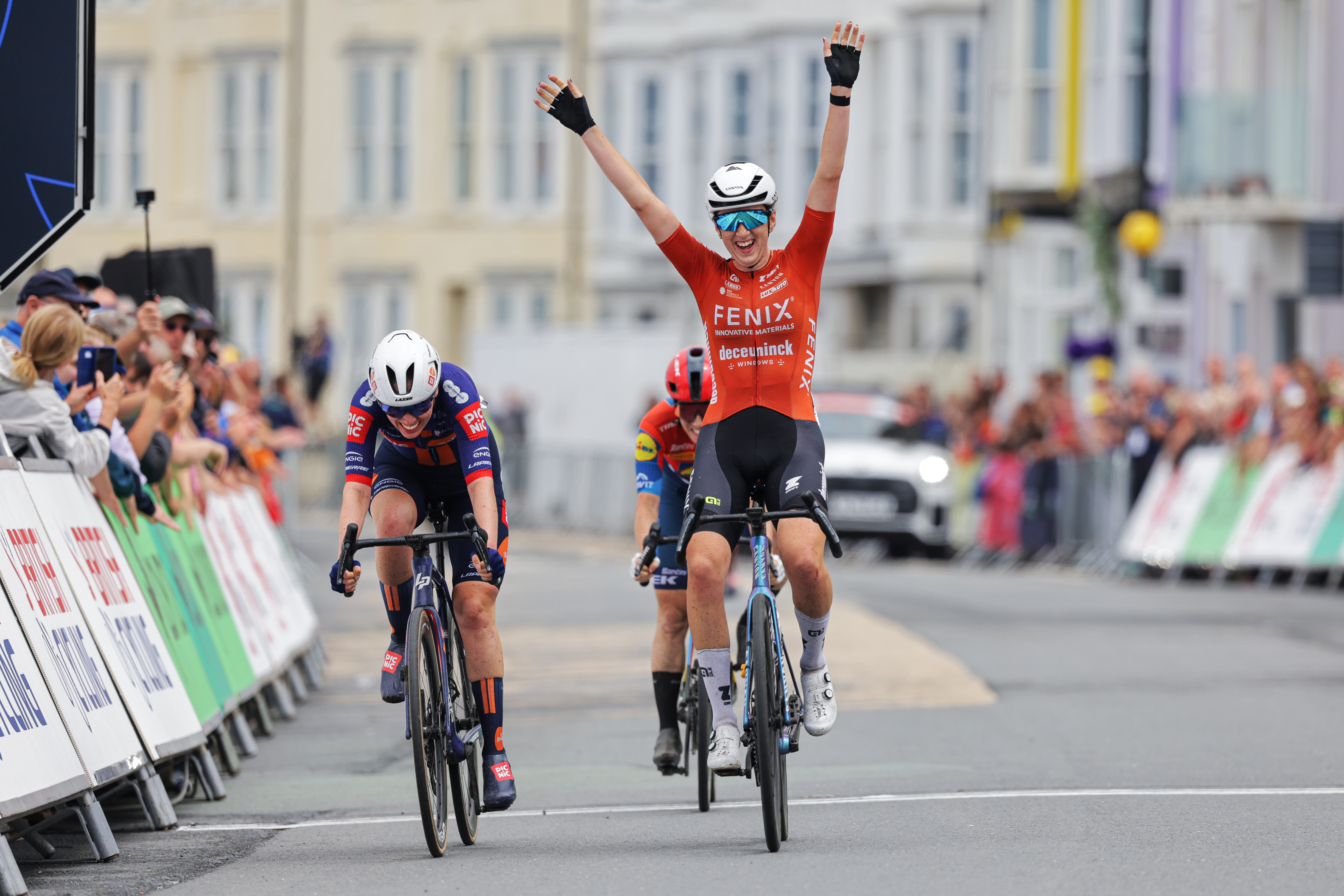 Millie Couzens celebrates as she wins the British national road race