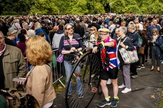 Well-wishers stand in the queue in Southwark Park for the Lying-in State of Queen Elizabeth II on September 16, 2022 in London, England.
