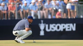 Bryson DeChambeau lines up a putt at the US Open