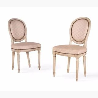 antique wooden chairs with pale pink upholstery