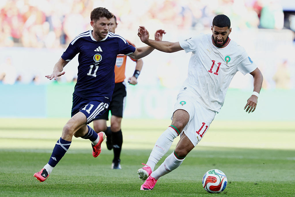 Morocco's midfielder #11 Ismael Saibari (R) and Scotland's forward #11 Ryan Christie 
