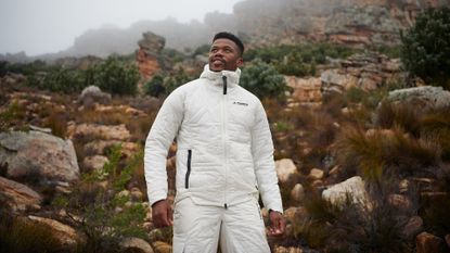 Man wearing new Adidas Terrex Hiking Collection for Fall/Winter 2021 in a mountainous landscape