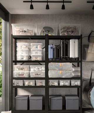 black metal storage shelves with plastic boxes labelled with party and decorations