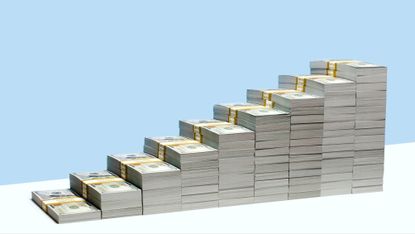 9 stacks of US $100 bill bundles in ascending size order on white shelf, blue background