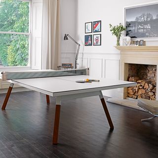 games room with wooden flooring and white wall