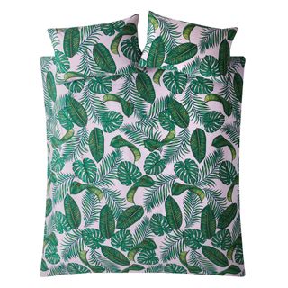 bed with coconut leaf and leaves quilt