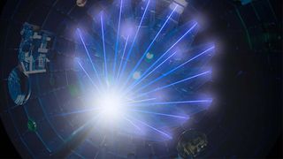 Several lasers at LLNL converge on a fuel source for nuclear fusion reactions