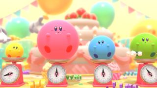 Four versions of Kirby in different colours in Kirby's Dream Buffet being weight on scales