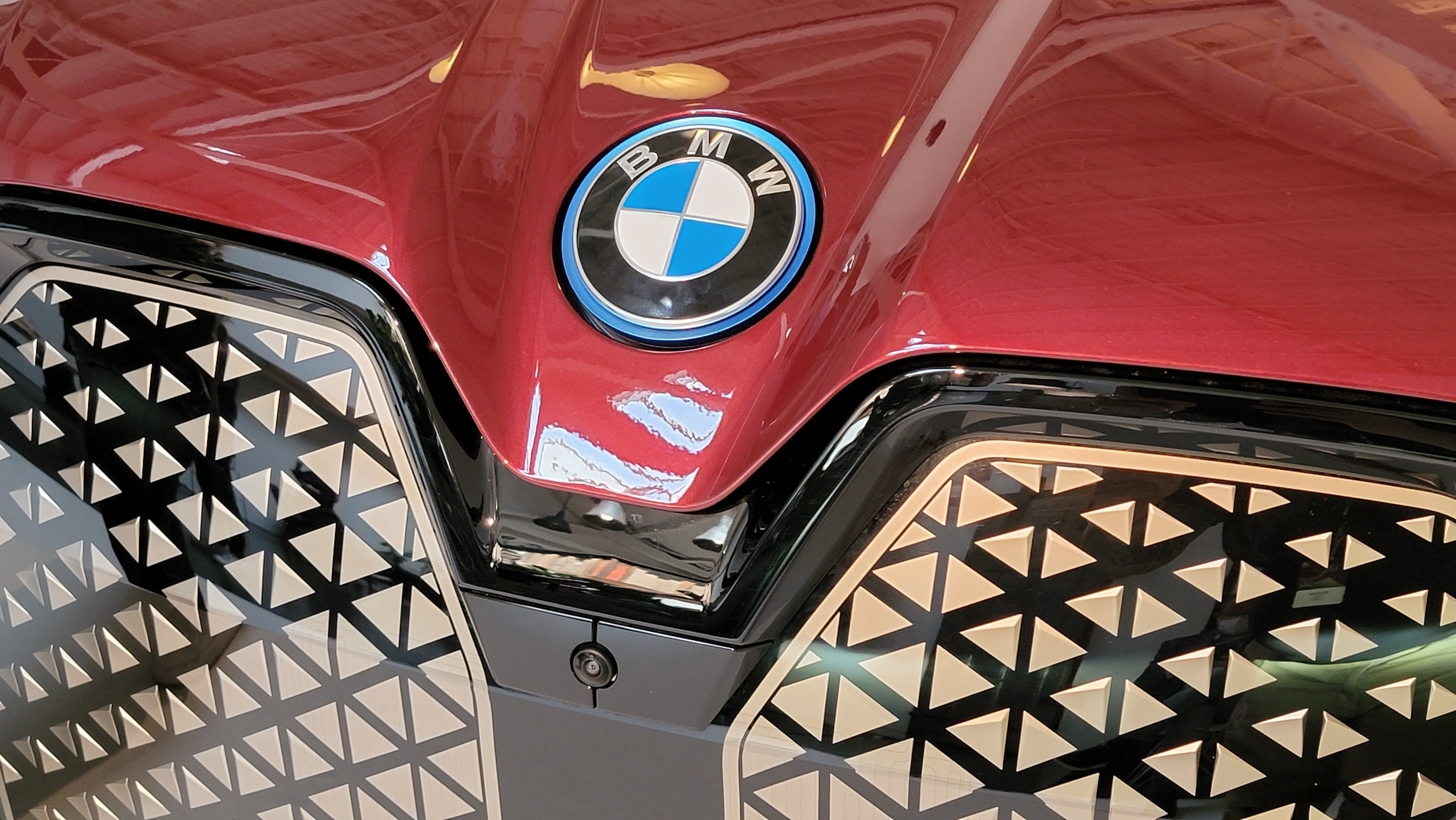 Close-up of the BMW badge on the iX