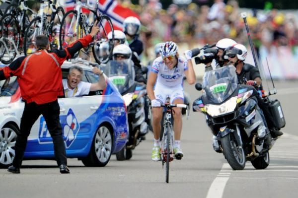 Marc Madiot screams with joy from the FDJ team car as PInot rides to victory