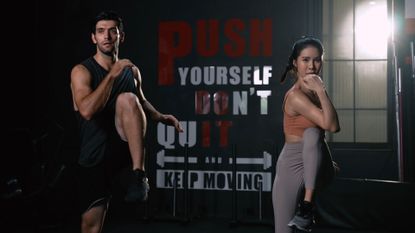 Image shows two people doing a HIIT workout