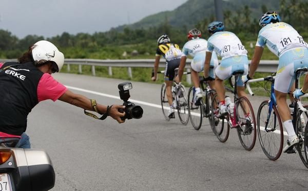 A photographer takes a blind shot during the stage.