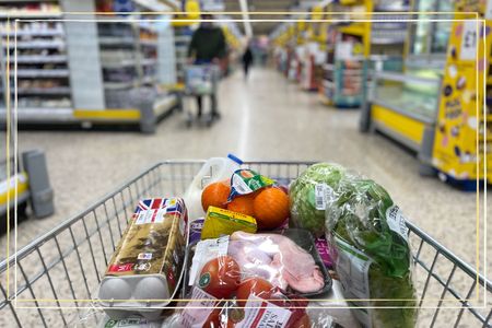 A close up of a full shopping trolley in a supermarket