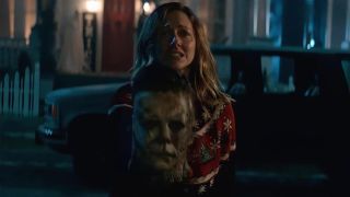Judy Greer with Michael Myers mask in Halloween Kills