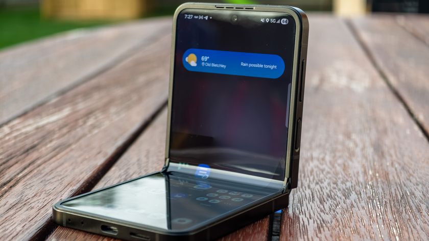 Samsung Galaxy Z Flip 7 FE in Black in flex mode on a table