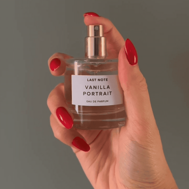 Hand with almond red nails spritzing the Boots Last Note Vanilla Portrait Eau de Parfum bottle