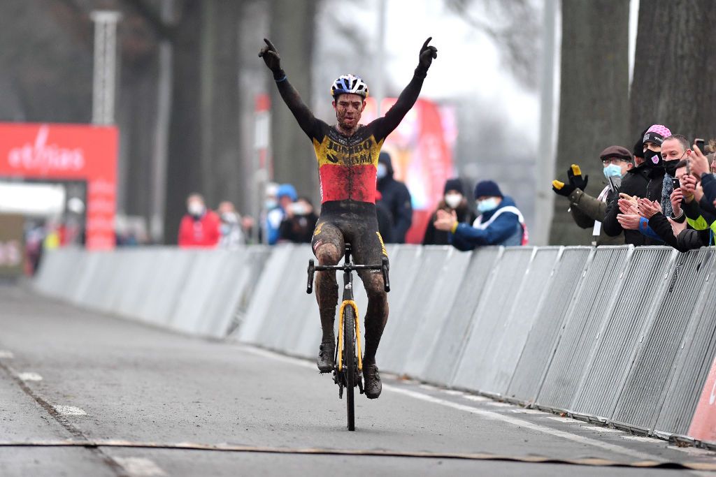 DENDERMONDE BELGIUM DECEMBER 26 Wout Van Aert of Belgium and Team JumboVisma celebrates at finish line as race winner during the 2nd Dendermonde UCI CycloCross Worldcup 2021 Mens Elite CXWorldCup UCIcyclocrossWC on December 26 2021 in Dendermonde Belgium Photo by Luc ClaessenGetty Images