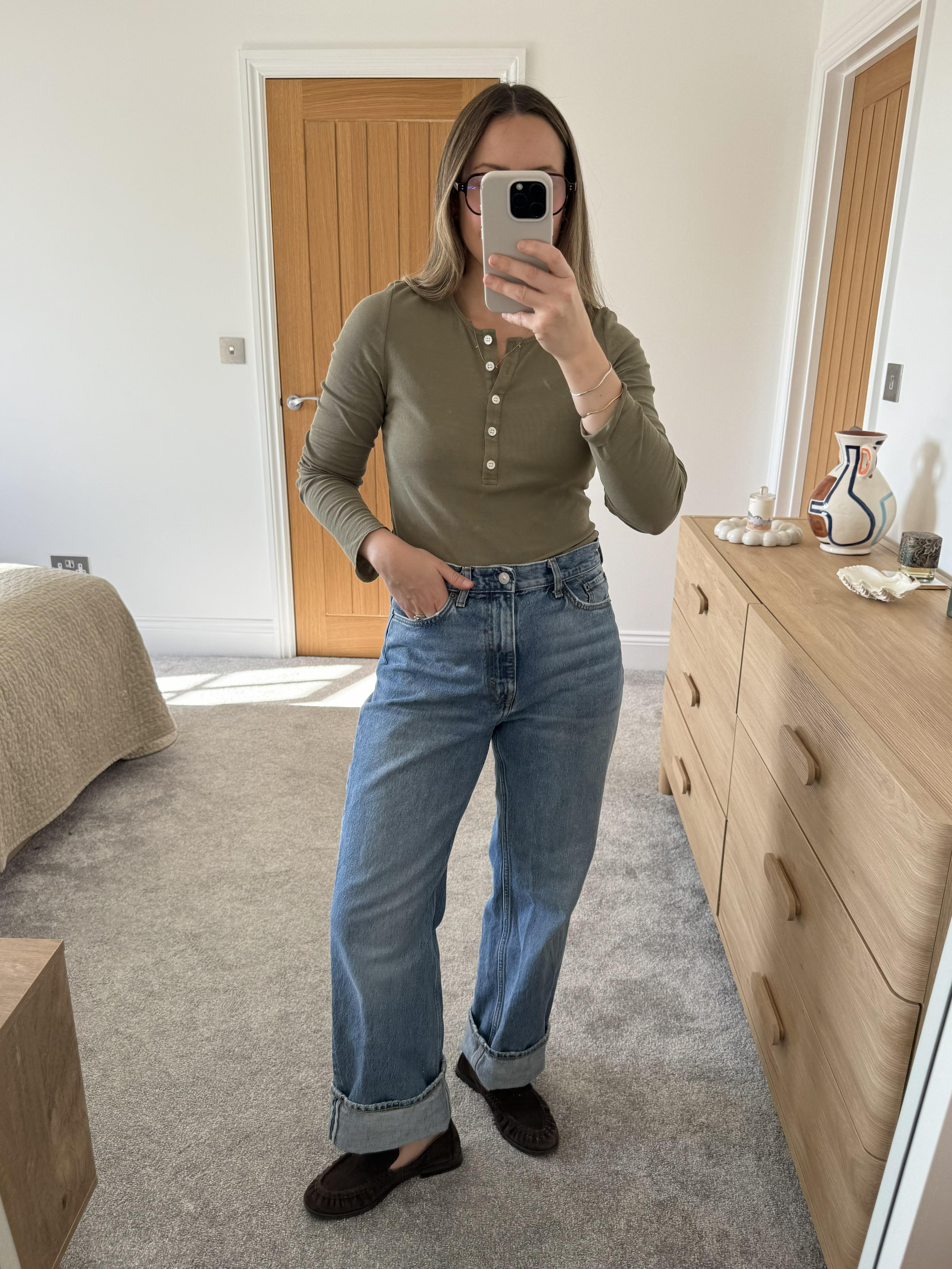 woman wears cos jeans