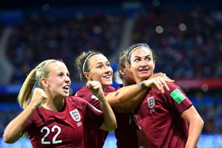 England's forward Jodie Taylor (R) celebrates with teammates after scoring the opening goal during the France 2019 Women's World Cup Group D football match between England and Argentina, on June 14, 2019, at the Oceane Stadium in Le Havre, northwestern France.