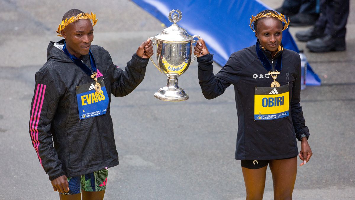 Boston Marathon 2023 winners Evans Chebet and Hellen Obiri hold the trophy together