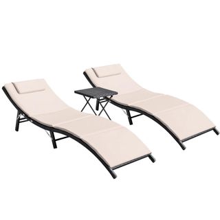 Two lounge chairs with black metal frame and beige cushions