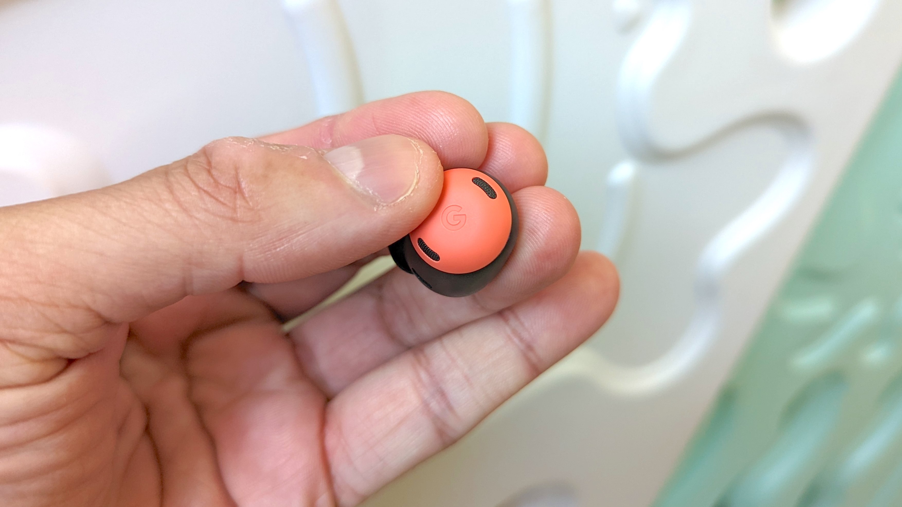 Our reviewer testing the Google Pixel Buds Pro's touch controls