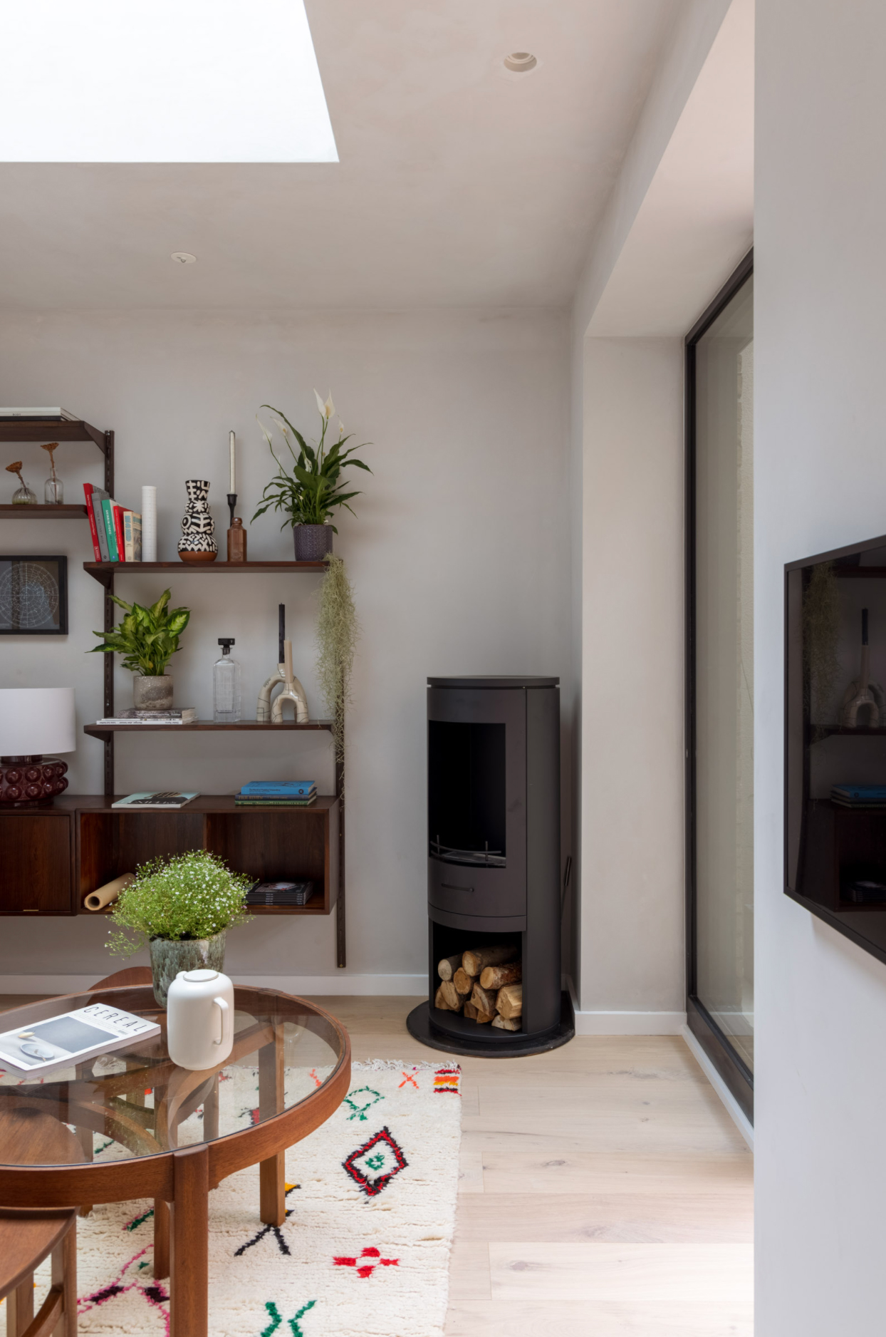 Flueless corner log burner in a small living room