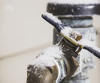 Frozen water shut off handle in snowstorm