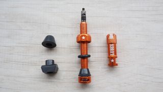 The various parts of a bicycle tubeless wheel valve set